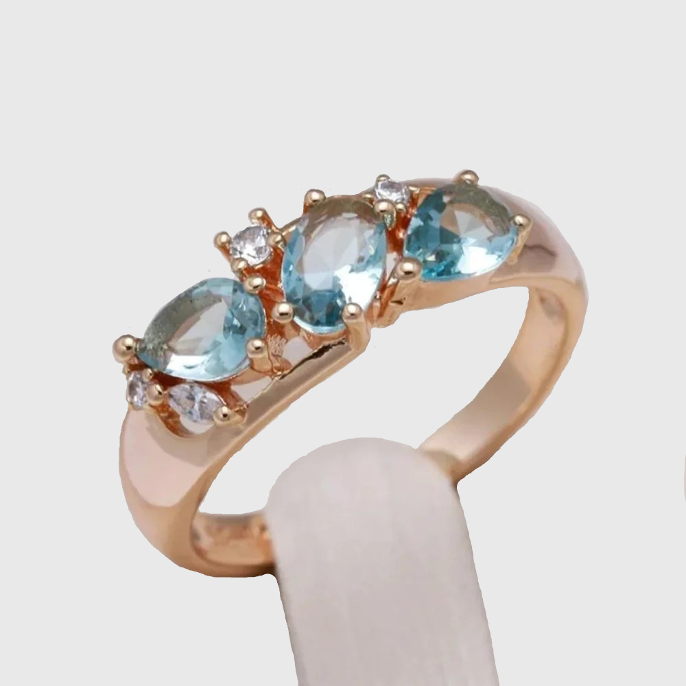Gold ring with blue zirconia